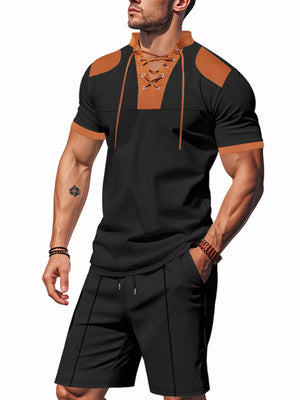 Black casual two-piece set with lace-up detail on collar and contrast tan accents.