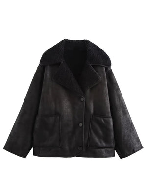 Black aviator jacket with shearling trim and button closure.