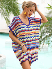 Chevron knit beach cover-up with multicolor zigzag pattern and V-neck.