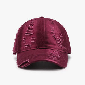 Distressed canvas baseball cap in burgundy with frayed details.