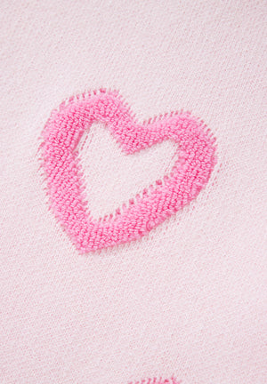 Pink knit sweater with fuzzy heart appliqué detail