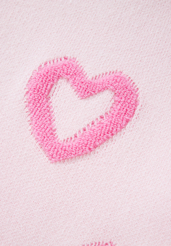 Pink knit sweater with fuzzy heart appliqué detail
