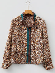 Leopard print button-down shirt with frilled collar and contrast trim.