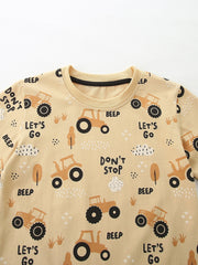 Toddler beige cotton t-shirt with playful tractor print and text details.
