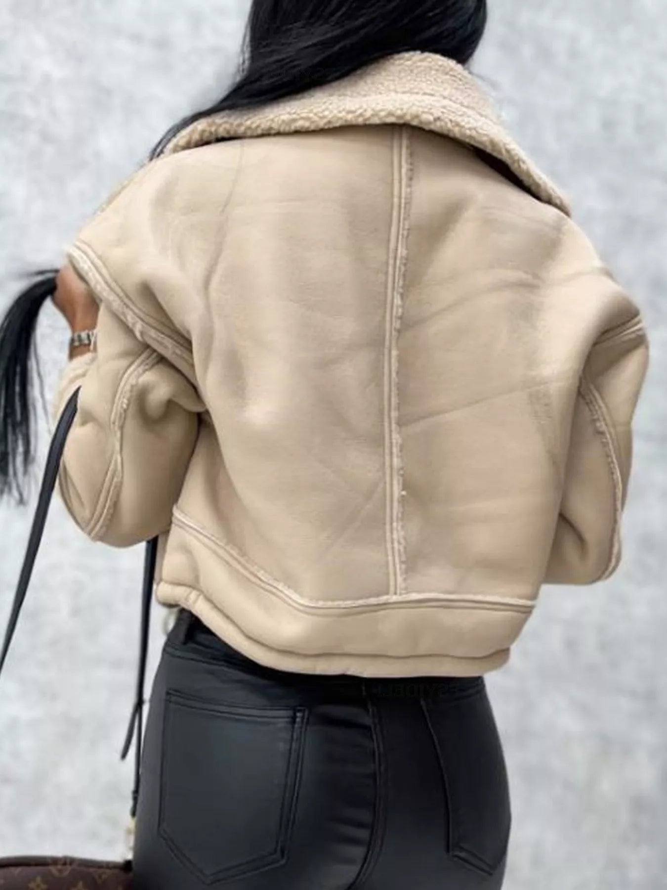 Beige cropped sherpa-trim jacket with contrast stitching and a relaxed fit.