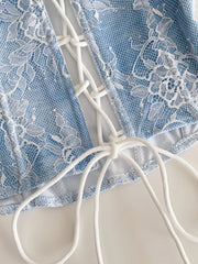 Blue floral lace corset top with white lace-up front detail and adjustable ties.