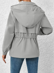 Gray hooded utility jacket with cinched waist detail and elastic cuffs.