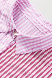Pink striped button-up blouse with ruffle sleeves and collar detail