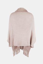 Blush pink faux fur trimmed fringe cape with a knit texture.