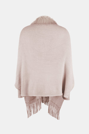 Blush pink faux fur trimmed fringe cape with a knit texture.