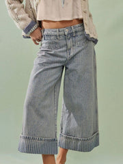 Light blue high-waisted cropped jeans with vertical pinstripe cuffs