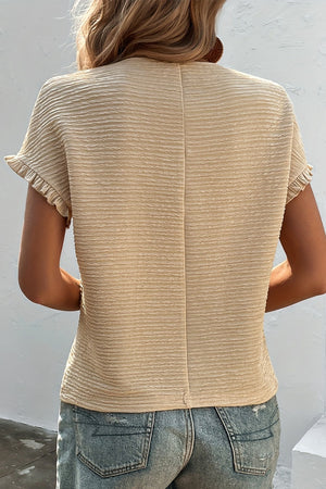 Dust Storm ruffle sleeve top with textured fabric and short sleeves.