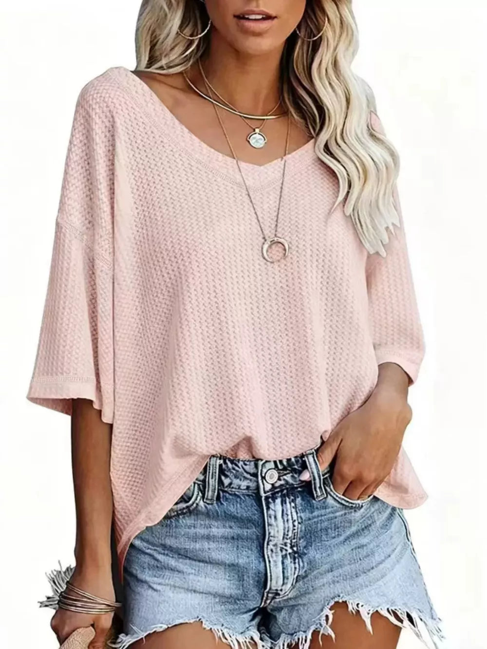 Waffle knit relaxed v-neck t-shirt in Coral Pink with a loose fit and short sleeves.