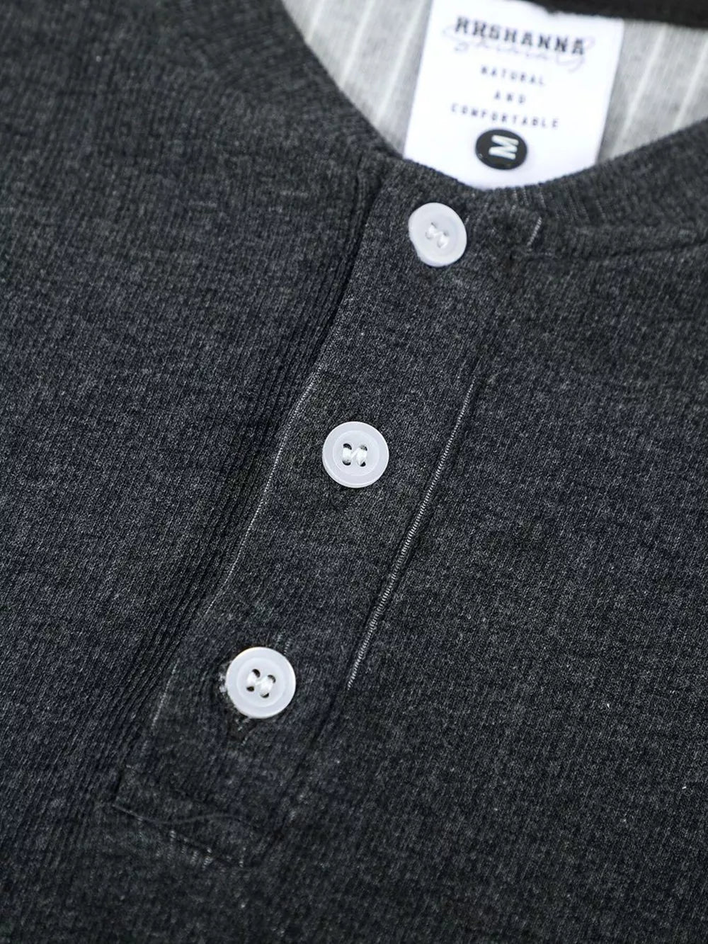 Men's dark gray textured ribbed henley t-shirt with three white buttons and a striped collar detail.