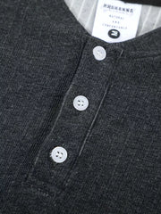 Men's dark gray textured ribbed henley t-shirt with three white buttons and a striped collar detail.