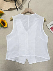 White textured cropped vest with tortoiseshell buttons