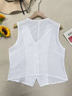 White textured cropped vest with tortoiseshell buttons