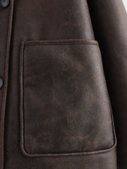 Chocolate aviator jacket with a patch pocket and button detail.
