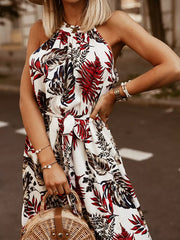White floral print maxi dress with braided halter straps and a belted waist.