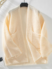 Chunky knit open front cardigan in cream with pockets and a relaxed fit.