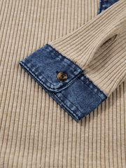 Cozy ribbed knit shirt with denim cuff and button detail.