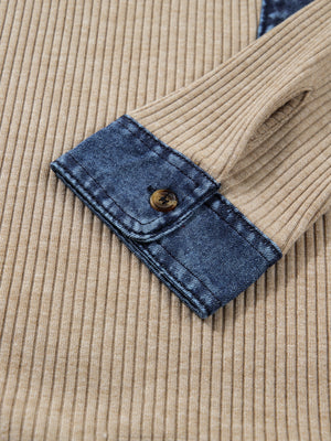 Cozy ribbed knit shirt with denim cuff and button detail.
