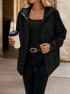 Black zip-through hooded jacket with a casual cut, worn open over a black tank top.