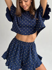 Blue star print crop top and ruffled shorts set made of polyester.