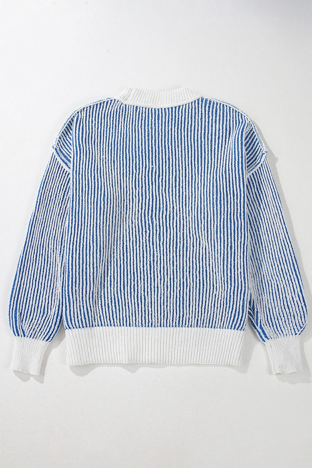 Light blue and white striped drop-shoulder knit sweater with ribbed cuffs and hem
