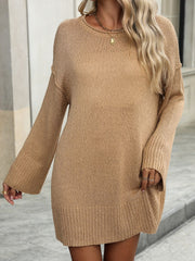 Camel oversized ribbed knit tunic sweater with crew neck and bell sleeves.