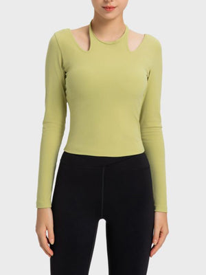 Yellow-green ribbed sport top with cutout shoulders and long sleeves.