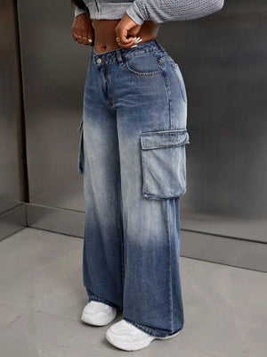 Vintage wide-leg cargo jeans in light wash denim with ombre fading and large side pockets.