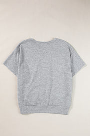 Gray short sleeve sweatshirt with a notch neckline and ribbed hem.