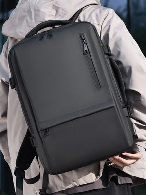 Black convertible commuter backpack with multiple zippered pockets and padded straps.