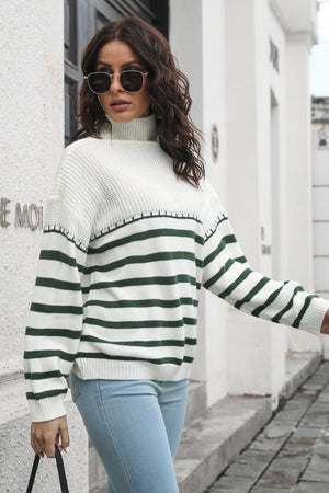 Turtleneck Breton stripe knit sweater in white with dark green stripes and a boucle texture.