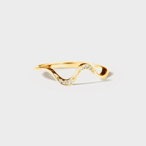 Gold serpentine diamond contour ring with a wavy design.