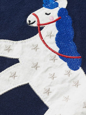 Navy cotton polo shirt with embroidered white unicorn graphic and blue mane.