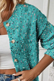 Turquoise confetti knit button-up cardigan with a relaxed fit.