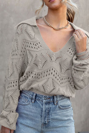 Gray openwork collar knit sweater with V-neck and long sleeves.