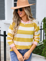 Striped acrylic sweater in Sherbet and white with pink ribbed cuffs and neckline.