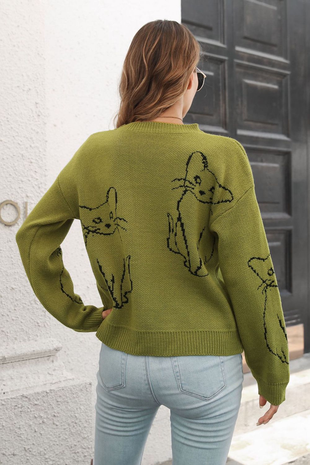 Matcha green acrylic sweater with black cat intarsia knit pattern, crew neck, long sleeves.