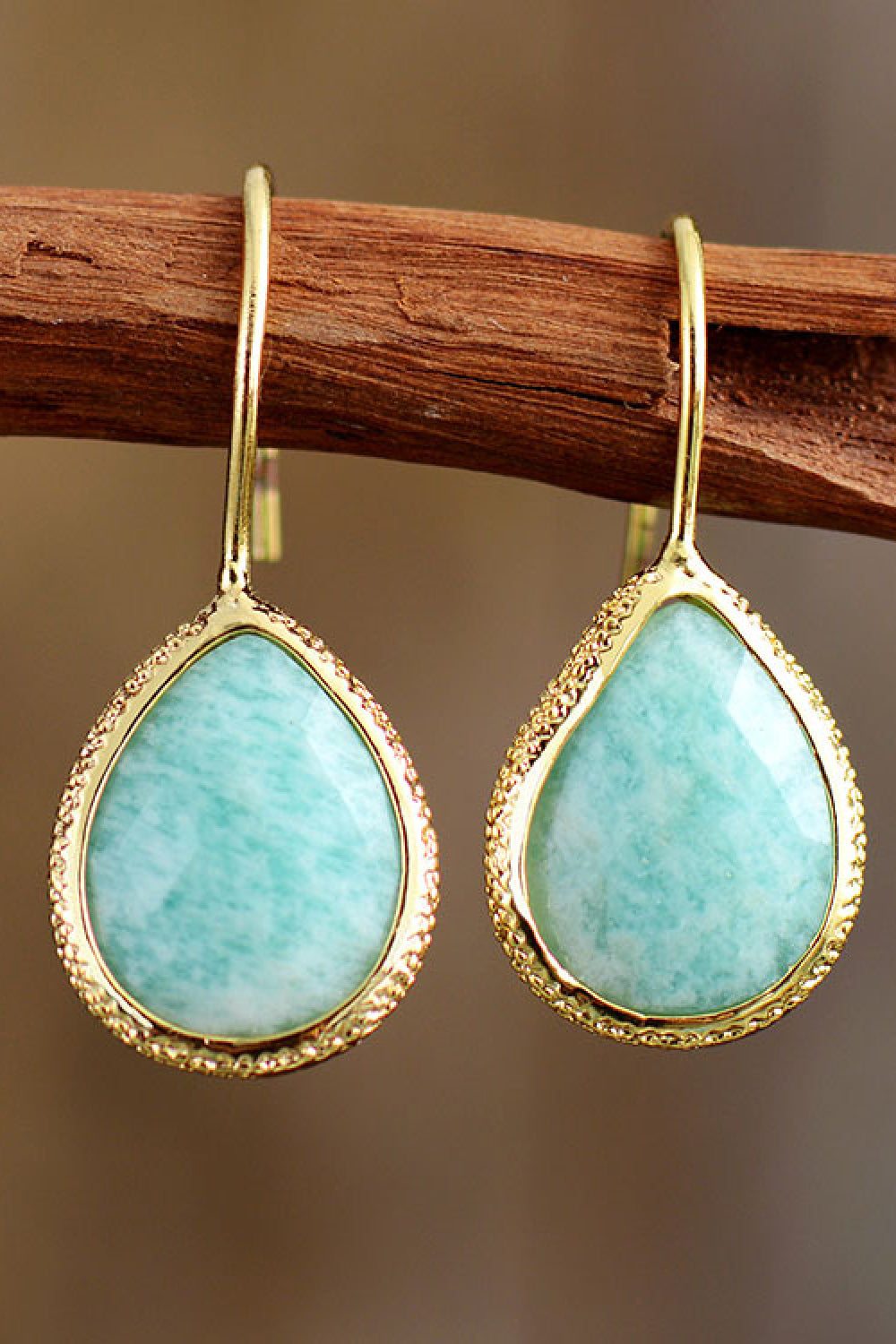 Textured aqua gemstone drop earrings with gold trim and hooks.