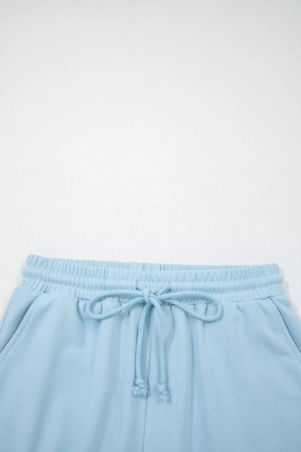 Light blue cotton bikini bottoms with drawstring waist and elastic waistband.