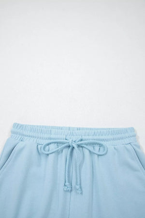 Light blue cotton bikini bottoms with drawstring waist and elastic waistband.