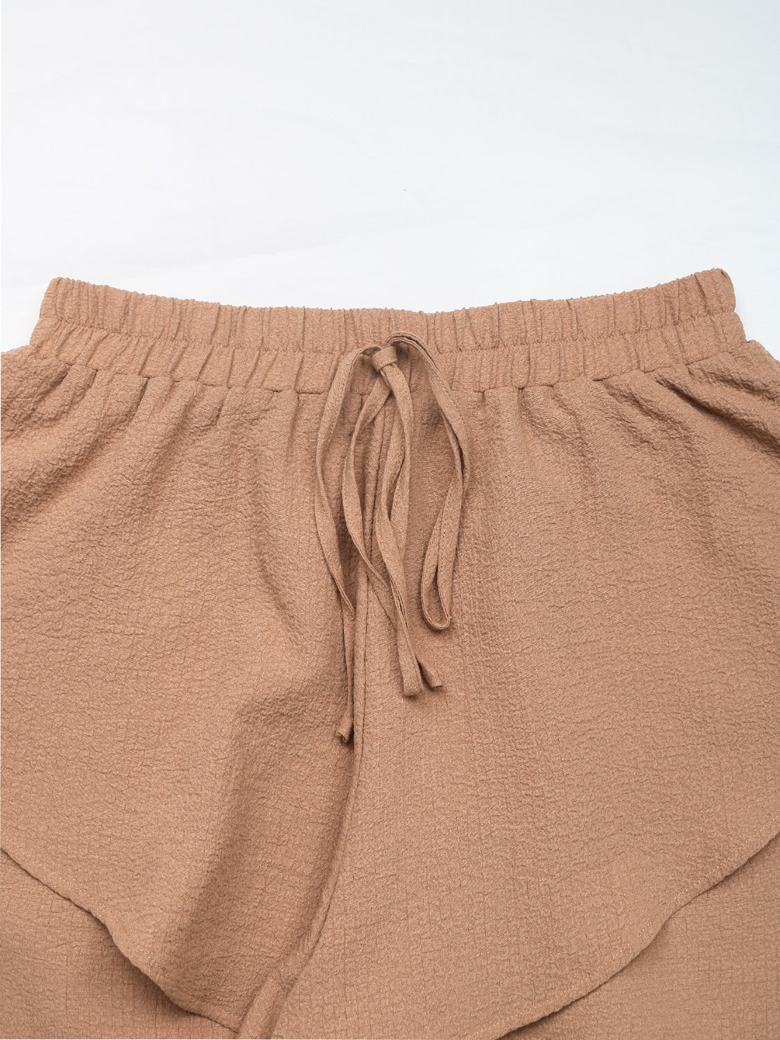 Camel tiered ruffle waistband shorts with drawstring detail
