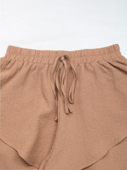 Camel tiered ruffle waistband shorts with drawstring detail
