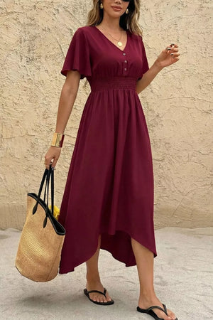 Burgundy V-neck flutter sleeve midi dress with smocked waist and button detail.