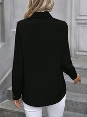Black linen-blend button-down shirt with long sleeves and button cuffs.