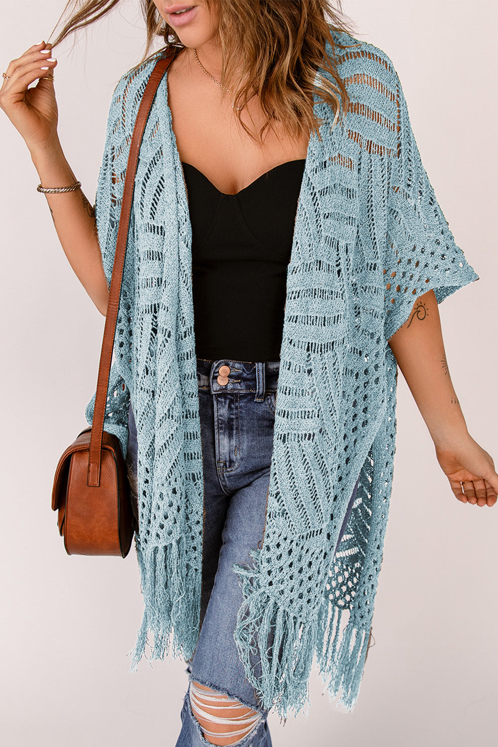 Light blue open knit chevron fringe cardigan with short sleeves and a boho style.