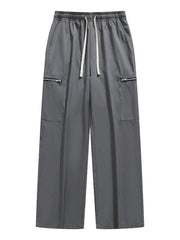 Dark gray wide-leg cargo pants with drawstring and zippered pockets.